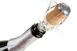 Photo: Bottle of champagne with splashes over white background Bottle of champagne with splashes over white background