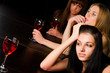 Young women in a night bar