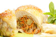 Chicken rolls with vegetables against white