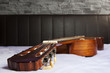 classical guitar lying on the bed