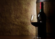 the still life with red wine, bottle, glass and old barrel