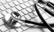 stethoscope on a white laptop