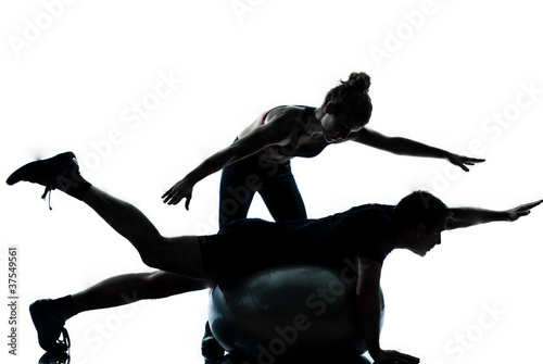 Photo: one couple man woman exercising workout fitness one couple man woman exercising workout fitness