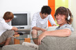 Three lads relaxing at home