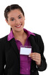 Woman displaying visitor badge
