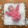 Newborn Baby in a packaging box.