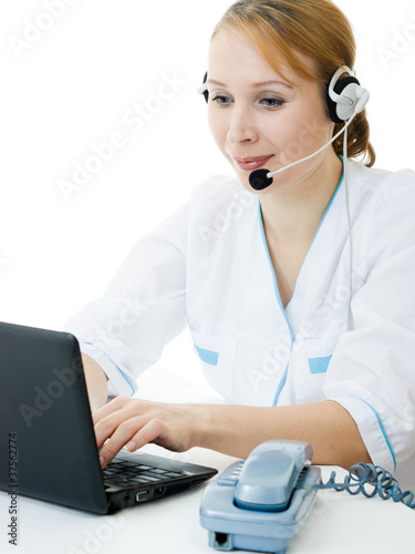 Photo: A woman doctor operator on a white background. A woman doctor operator on a white background.