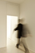 man walk across a door