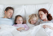 Family taking a nap together