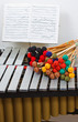 Marimba with coloured mallets and musical notes