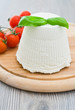Ricotta cheese with basil leaves.