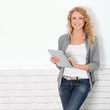 Beautiful modern woman using digital tablet
