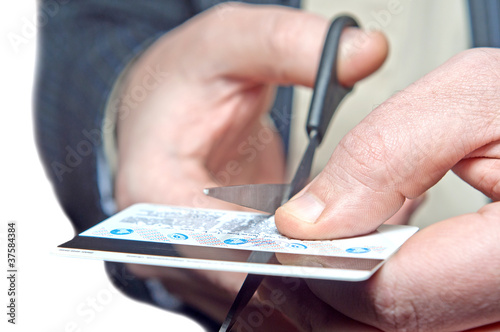 Photo: hands scissor a bank map hands scissor a bank map