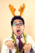 Businessman wear reindeer horn act funny reindeer.