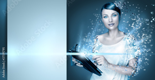Photo: Poster photo of young pretty woman using her tablet computer and Poster photo of young pretty woman using her tablet computer and