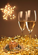 Christmas glasses of Champagne and golden background Christmas glasses of Champagne and golden background