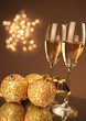 Christmas glasses of Champagne and golden background Christmas glasses of Champagne and golden background