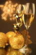 Christmas glasses of Champagne and golden background Christmas glasses of Champagne and golden background