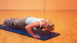 Woman doing push-ups in fitness center