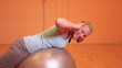 Woman exercising with gym ball