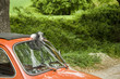Wedding ribbon on red vintage car