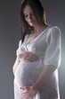 pregnant female holding her breasts pregnant female holding her breasts