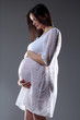pregnant female holding her breasts pregnant female holding her breasts