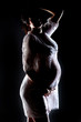 pregnant female holding her breasts pregnant female holding her breasts