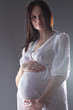 pregnant female holding her breasts pregnant female holding her breasts