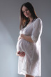 pregnant female holding her breasts pregnant female holding her breasts