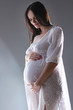 pregnant female holding her breasts pregnant female holding her breasts