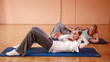 Women doing crunches in gym