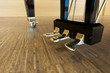golden piano pedals of a concert grand piano on concert stage