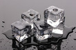 Melting ice cubes on grey background