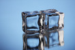 Ice cubes on blue background