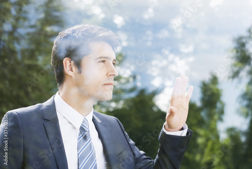Photo: Businessman looking out window Businessman looking out window