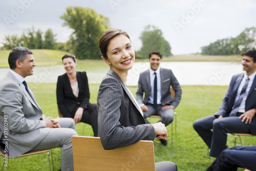 Photo: Business people having meeting outdoors Business people having meeting outdoors