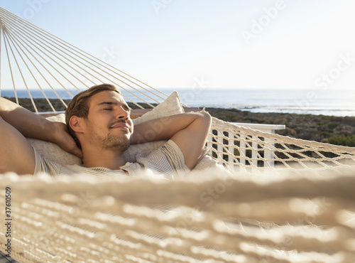Photo: Man napping in hammock Man napping in hammock