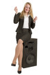 Happy Businesswoman Sitting On Speakers