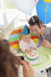 Parents celebrating baby?s first birthday
