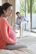 Husband putting together crib