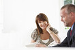 Financial advisor showing digital tablet to client