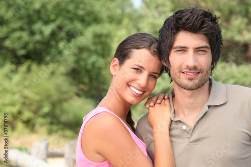 Photo: Portrait of a couple enjoying a day outdoors together Portrait of a couple enjoying a day outdoors together