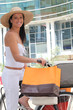 Woman transporting her shopping bags on her bike