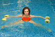 Photo: Woman in water with dumbbells Woman in water with dumbbells