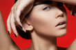 Woman with strong eyebrows makeup, dark manicure