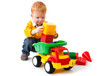 boy playing with car toy