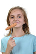 Young girl with boiled hot dog