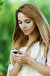 portrait of woman holding mobile phone