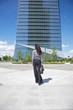 businesswoman walking to skyscraper